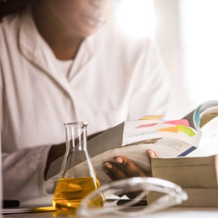 Photo of a pharmacist reading a textbook