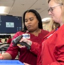 Lab technicians using a scanner