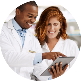 Pharmacists looking at an iPad