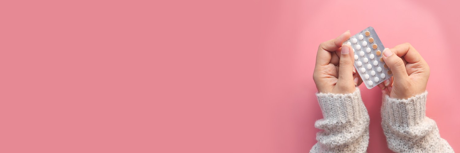 Female hands hold a sleeve of pills